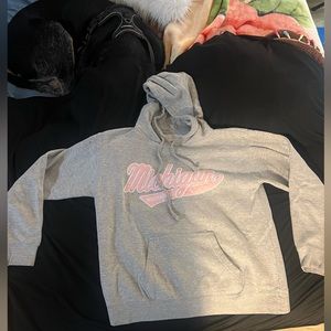 University of Michigan sweatshirt.